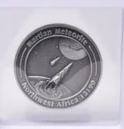 MARTIAN METEORITE WITH COLLECTORS COIN, NORTH WEST AFRICA 13190 MT127