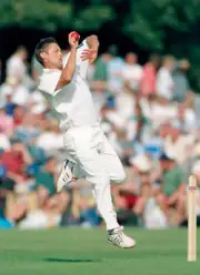 Gavin Larsen bowling for New Zealand during their match again- Old Cricket Photo