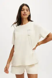 [Body] Body - Active Graphic Tshirt - Coconut milk/heritage club S COCONUT MILK/HERITAGE CLUB