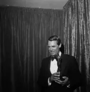 Actors Cary Grant poses with an Oscar for Ingrid Bergman in LA 1957 Photo