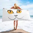 Beach towel - Cat face close up with yellow eyes