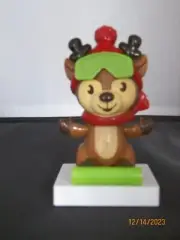 Solar Christmas House Reindeer with goggles riding a green sleigh bobble head