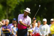 Golfer Juan Chi Chi Rodriguez swings and watches the flight of Golf 1988 Photo 5