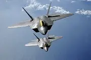 March 9, 2009 - Two F-22 Raptors Fly Over The Pacific Ocean During a Theater Security Mission as Part of a Deployment to Andersen Air Force Base, Guam. Poster Print (34 x 22)