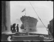 People on a wharf watching aircraft carrier H.M.A.S. Albatross in - Old Photo