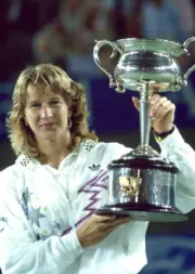 Steffi Graf of Germany poses with the trophy after defeating Chri - Old Photo