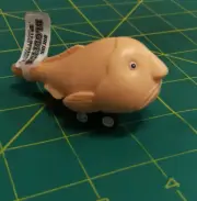 Archie Mcphee Racing Blobfish beige color - it's a pull back quick little racer