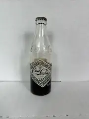 75th Anniversary Coca-Cola Bottle Half Full
