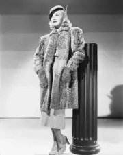 Ginger Rogers in costume for 'Swing Time' leans on a pillar with h- Old Photo
