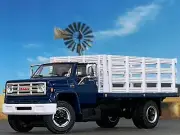 1/64 DCP BLUE/WHITE GMC 6500 SINGLE AXLE STAKE BED