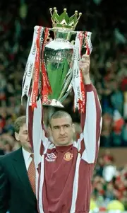 Eric Cantona of Manchester United holds aloft the FA Carling Premi- Old Photo
