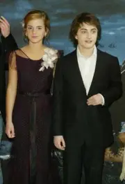 Daniel Radcliffe and Emma Watson attend the UK Premiere of Harry - 2004 Photo