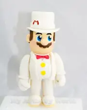 Edible 3D fondant/gum paste Mario in White Suit cake topper.