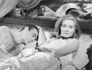 Sean Connery sleeping while Daniela Bianchi next to him is sitting- Old Photo