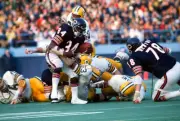 Running back Walter Payton Chicago Bears gets tackled by Fred Car- 1976 Photo