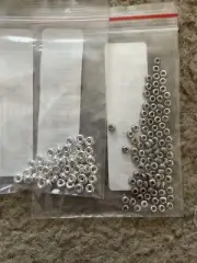 Several Small Silver And Steel Color Beads For String Or Wire Bracelets