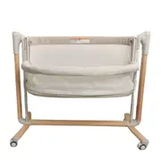 Baby Studio Baby Rockabye Bedside Sleeper Soothing Bassinet w/ Wheels 0-12m