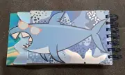 Shark 3 tiered spiral notebook.