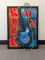 One of a kind Guitar Artwork made using Recycled materials. Mixed Media, collage