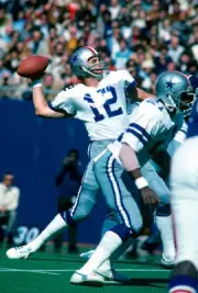 Quarterback Roger Staubach of Dallas Cowboys drops back to pass v- 1976 Photo 4
