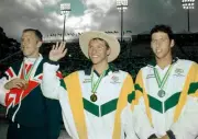 Ian Thorpe of Australia waves to the crowd alongside fellow medali- Old Photo