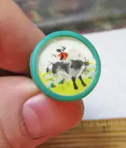 plastic 1960s dime store vending machine toy Flicker Ring, Cowboy on bronco, grn