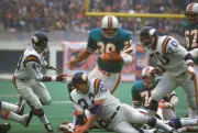 Larry Csonka Miami Dolphins carries the ball v the Minnesota Viki- 1974 Photo 4
