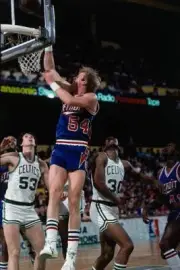 Kent Benson Detroit Pistons goes up for a shot against the Boston- Old Photo