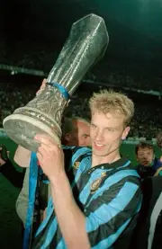 Dennis Bergkamp of Inter Milan holding the trophy following the UE- Old Photo