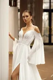 Miranda - A-line boho bridal gown with thin straps and long sleeves.