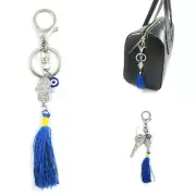 Add a touch of spirituality to your accessories with this Hamsa Tassel Keychain