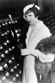 Franco-American actress Claudette Colbert in her wine cellar in 1933 Old Photo