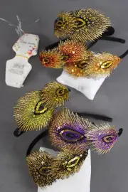 Headband with vinyl peacock-feather applique, gold thread, and sequins