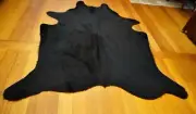 A Neat and Compact Jet Black Aberdeen Angus Cowhide Rug - Naturally Beautiful