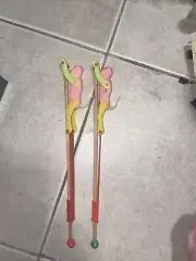 2-1950s Plastic Toy Climbing Acrobatic Monkey on a wood stick Yellow Pink