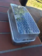 A WALL SECURITY FIXTURE WITH 9 WATT LED LIGHT BULB