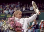 Steffi Graf of Germany lifts the trophy after defeating Martina N - Old Photo