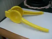 Hand held yellow metal hinged lemon / lime juice squeezer juicer kitchen barware