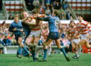 Ian Potter of Wigan is tackled by Steve Peters and Peter Gorley o - Old Photo