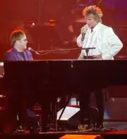 Singer songwriters Sir Elton John and Rod Stewart perform during A - Old Photo 5