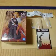 New and Unopened Demon Slayer Kyojuro Rengoku Figure + Metal Charm (Sword Shape)