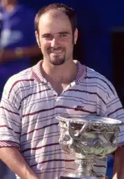 Andre Agassi USA poses with the trophy after defeating Pete Sampra- Old Photo