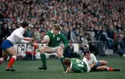 Brendan Mullin passes to teammate Trevor Ringland of Ireland whil - Old Photo