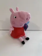 Peppa Pig in a red dress plush. Item is new with tags