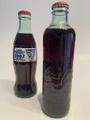 COLLECTABLE COCA COLA BOTTLES (NEVER BEEN OPENED ORIGINAL SODA INSIDE)