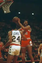Chet Walker Chicago Bulls grabs a rebound in front of Manny Leaks- 1974 Photo