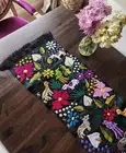 Table runner with animals and birds, hand-woven in a black tone and multicolor.