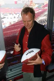 Sting at Super Bowl XXXV - Sting Autographs Football at Raymond Ja- Old Photo