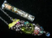 KIRKS FOLLY VERY RARE/SIGNED "STARLITE FOLLY DUST VIAL W/MERMAID NECKLACE"