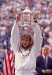 Steffi Graf of Germany lifts the trophy after defeating Martina N - Old Photo 5